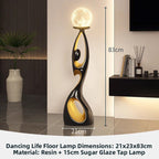 Black Dancing Life landing night light floor lamp glowing in a modern living room