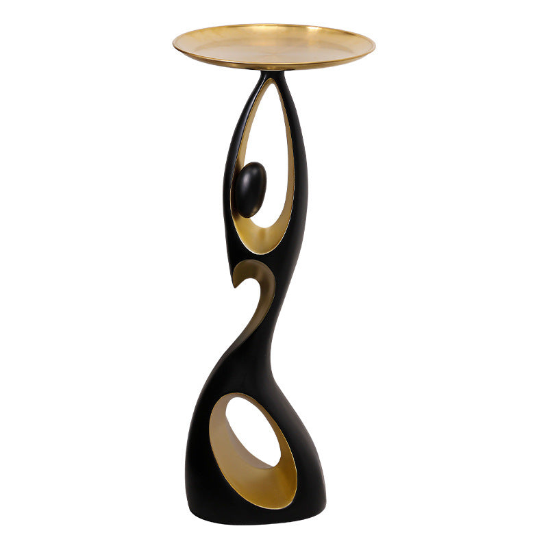 Black and gold Dancing Life floor ornament on a white background