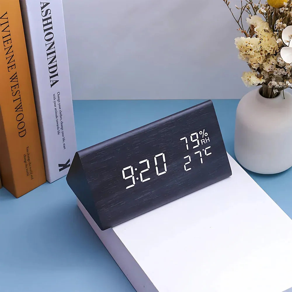 Digital alarm clock in wood finish showing a bright, clear LED display