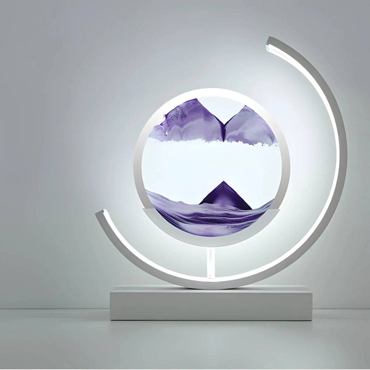 Glass quicksand painting table lamp with moving sand art on a desk