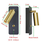 Black and gold modern wall lamp glowing warmly