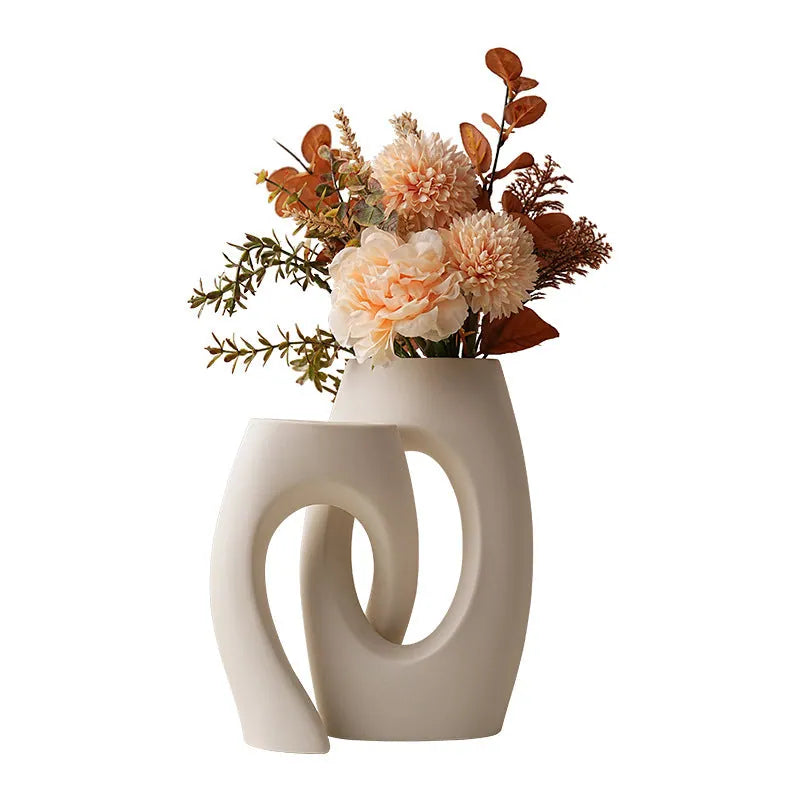 White ceramic cross-tube vase in a table setting