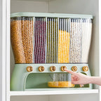 Grain storage box on a kitchen cabinet shelf dispensing grains into the collection drawer