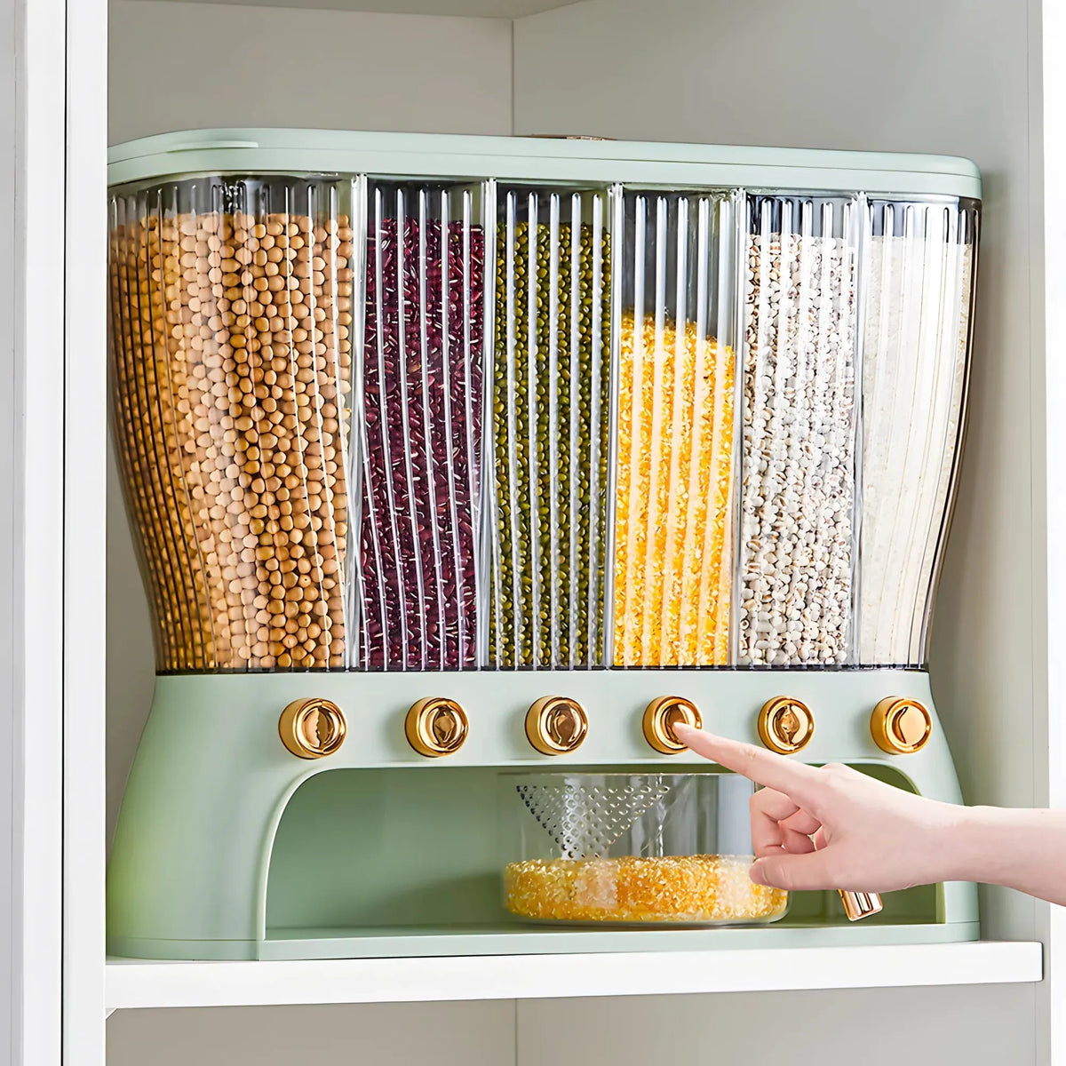 Grain storage box on a kitchen cabinet shelf dispensing grains into the collection drawer