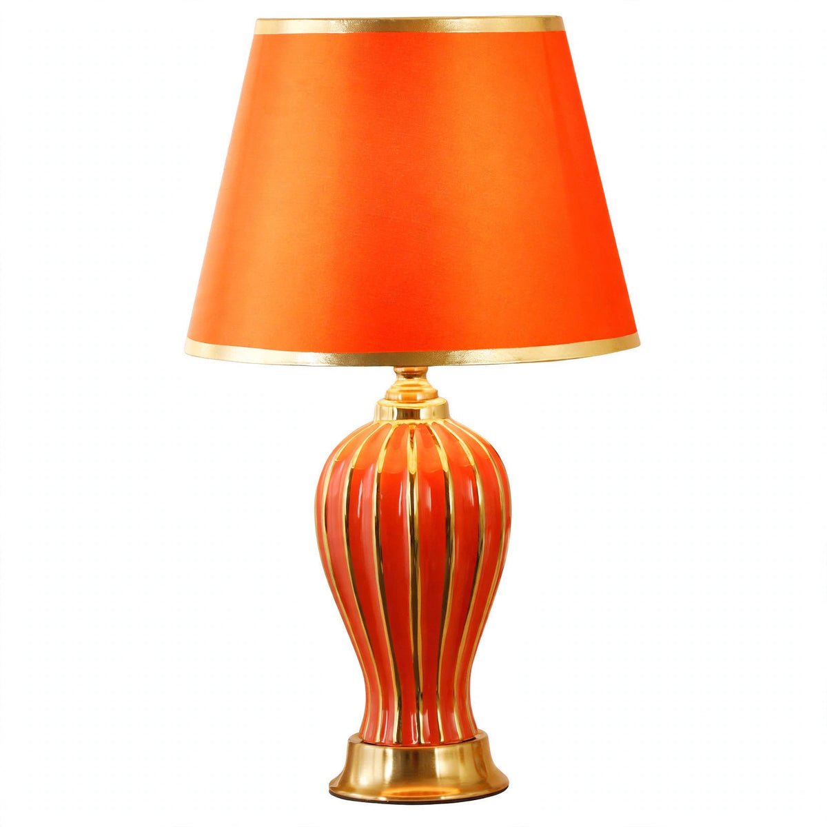 Red ceramic table lamp with fluted ceramic base on a white background